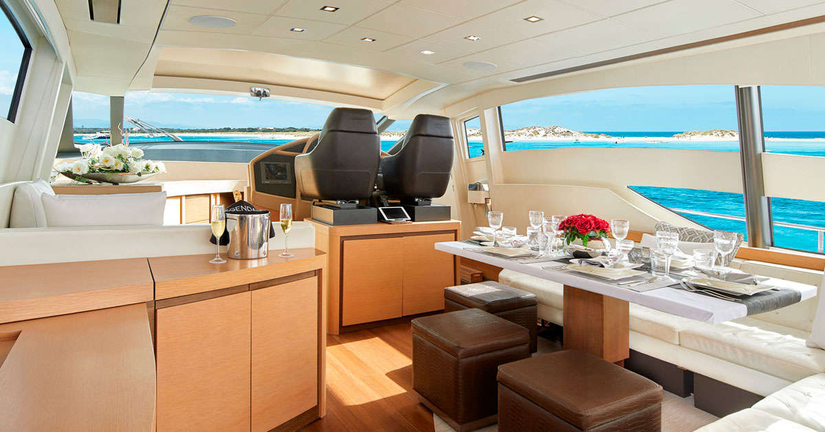 Group of friends enjoying a rented yacht off the coast of Ibiza